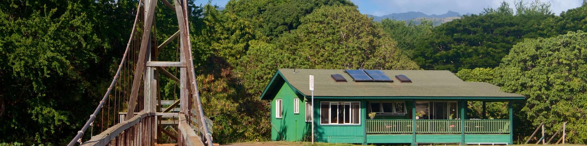 Hanapepe showing a house and a suspension bridge or treetop walkway