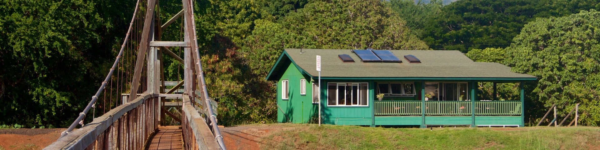 Hanapepe showing a house and a suspension bridge or treetop walkway
