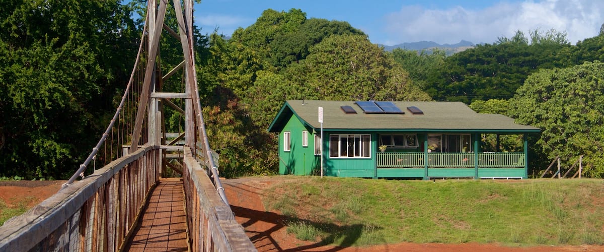 Hanapepe showing a suspension bridge or treetop walkway and a house