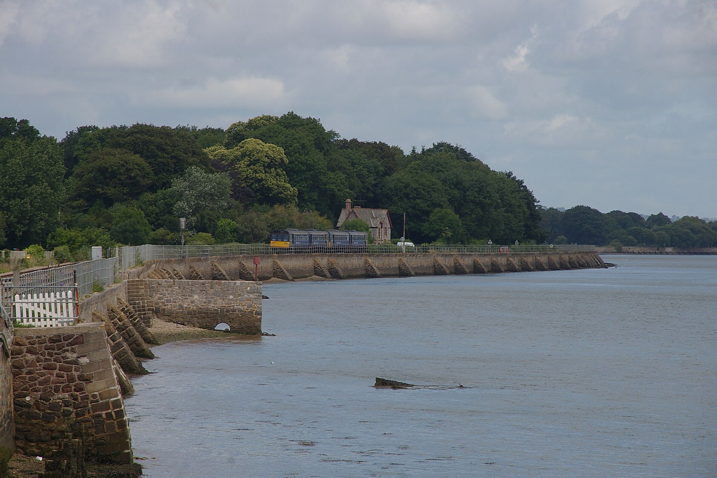 First Great Western 142029/142063 heads north away from Starcross railway station, bound for Exmouth.