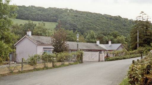 Former station at Christow, 1984. View SE in the Teign Valley, towards Heathfield: Exeter - Heathfield (- Newton Abbot) line. Yet another station converted to a private house, Christow station had been closed from 9/6/58 along with the line from Exeter. However, goods traffic continued from the Heathfield end until later severe flood damage eventually led to closure from 1/5/61 as far as Trusham although the last section to Heathfield remained in use until 1/7/68.
