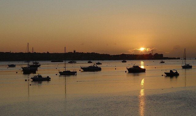 Sunrise over the Exe estuary. Taken 45 seconds before 1046598 and from about a kilometre further south, looking across moored boats towards Exmouth.