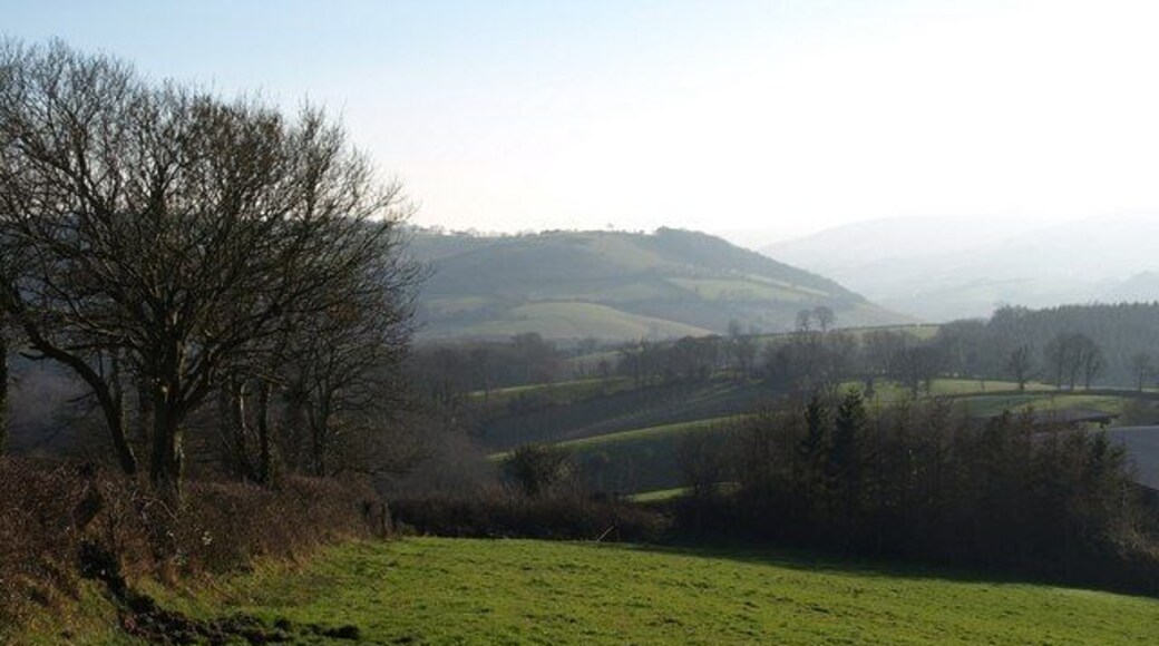 From above Easternhill Farm. Doddiscombsleigh Footpath 2 runs along the left side of this field. The farm buildings shown in 690268 are on the right. The view beyond is down the Batt's Brook valley as it makes it way towards the Teign valley in the distance.