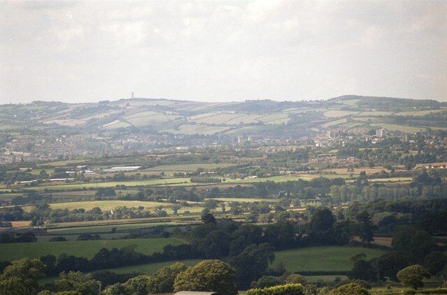 Rolling hills, a distant town, and a river.