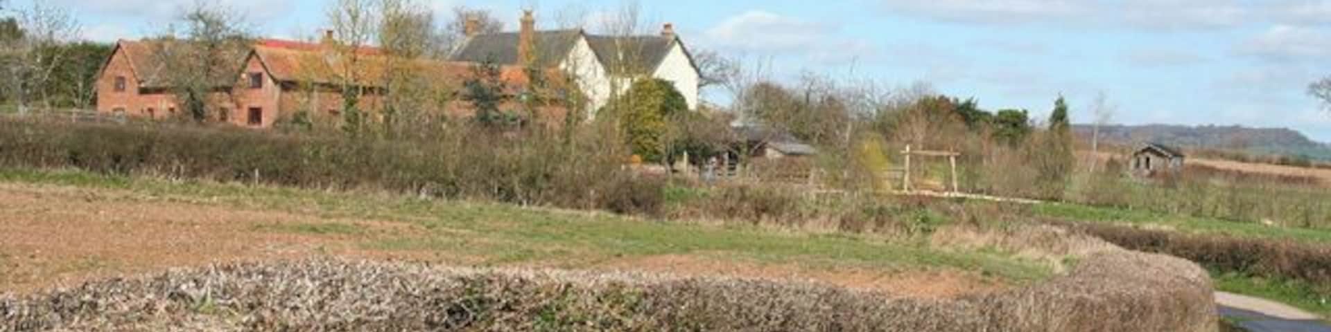 Talaton: Lashbrook Farm. Seen from the bridge over the railway to the south. Some farm buildings appear to have been converted to residential accommodation