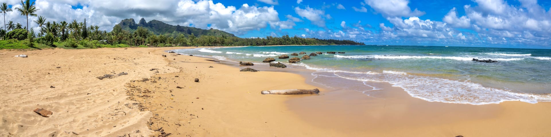 Panoramic view of Anahola Beach in the north coast of Kaua'i, with the iconic Kalalea mountain range in the background, Hawaii, USA