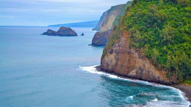 A coastal landscape with cliffs and a calm sea.