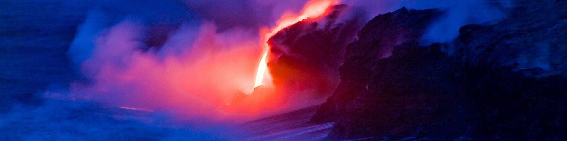 Pahoa featuring rocky coastline, night scenes and mist or fog