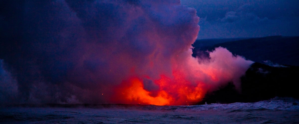 Pahoa which includes mist or fog, night scenes and general coastal views