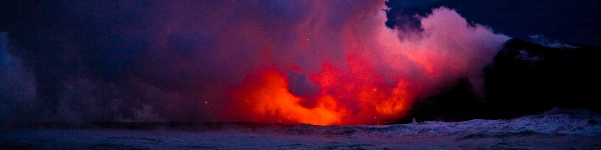 Pahoa which includes general coastal views, night scenes and mist or fog