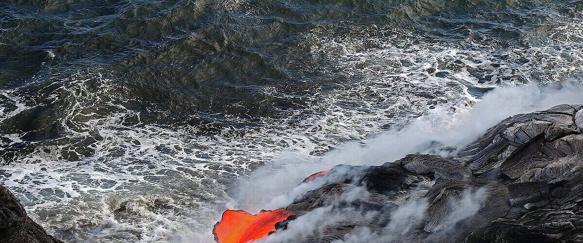 #NationalPark While watching the lava flow in the ocean down the coast line a large section broke open directly underneath us and spilled into the ocean. The picture below is the exact moment it caved in and fell in the water below.