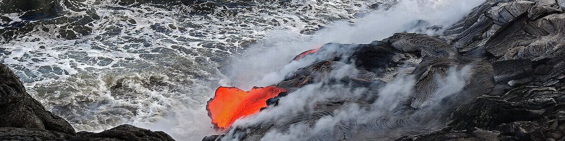 #NationalPark While watching the lava flow in the ocean down the coast line a large section broke open directly underneath us and spilled into the ocean. The picture below is the exact moment it caved in and fell in the water below.