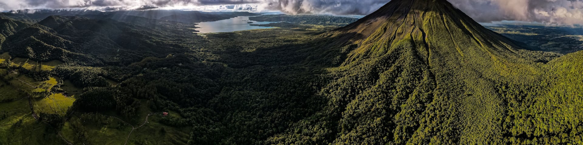 Beautiful aerial view of the Arenal Volcano, the arenal Lagoon, and rain forest in Costa Rica