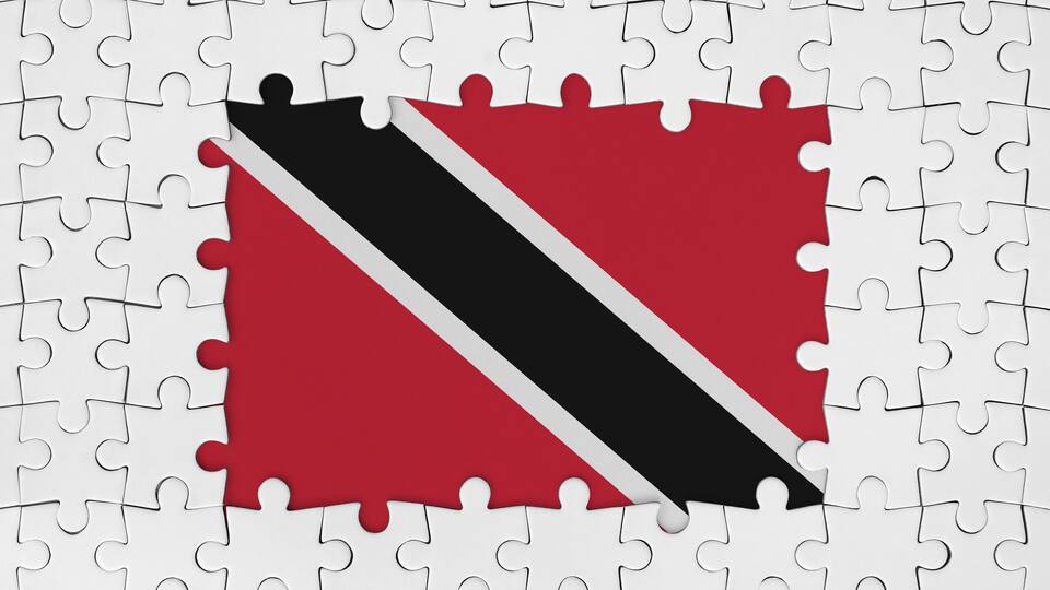 A jigsaw puzzle with a piece missing, revealing a flag with a diagonal black and white stripe on a red background.