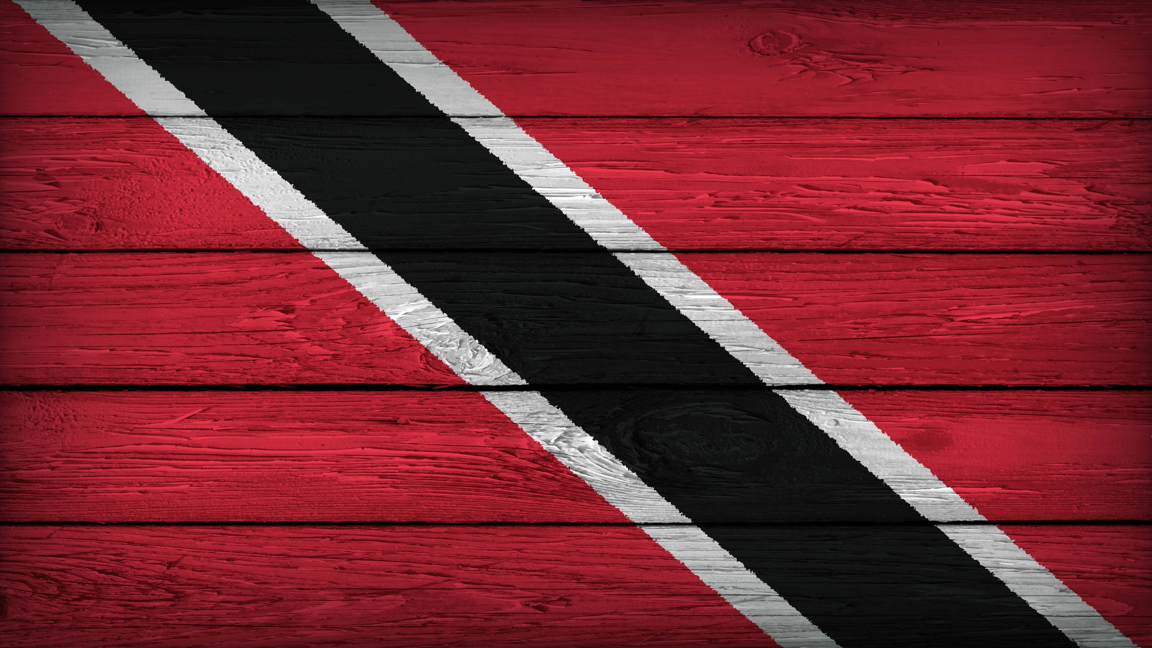 The flag of TRINIDAD painted on a wooden table with Original Colors