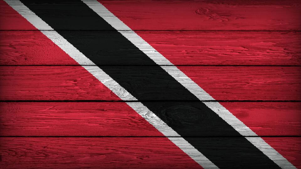 A red wooden surface with diagonal black and white stripes.