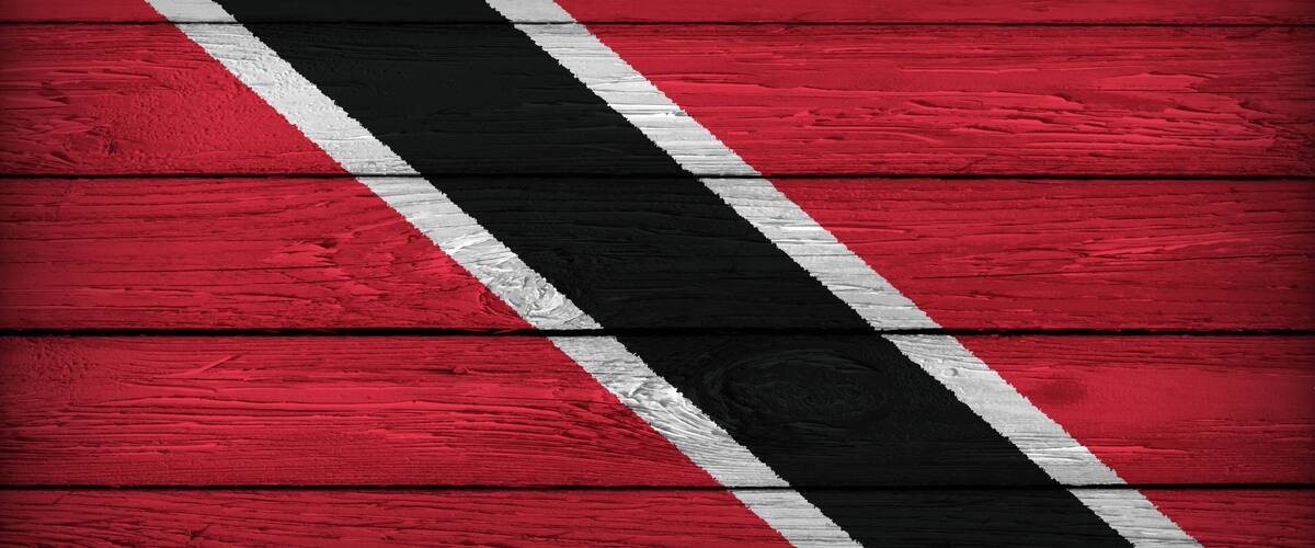 A red wooden surface with diagonal black and white stripes.