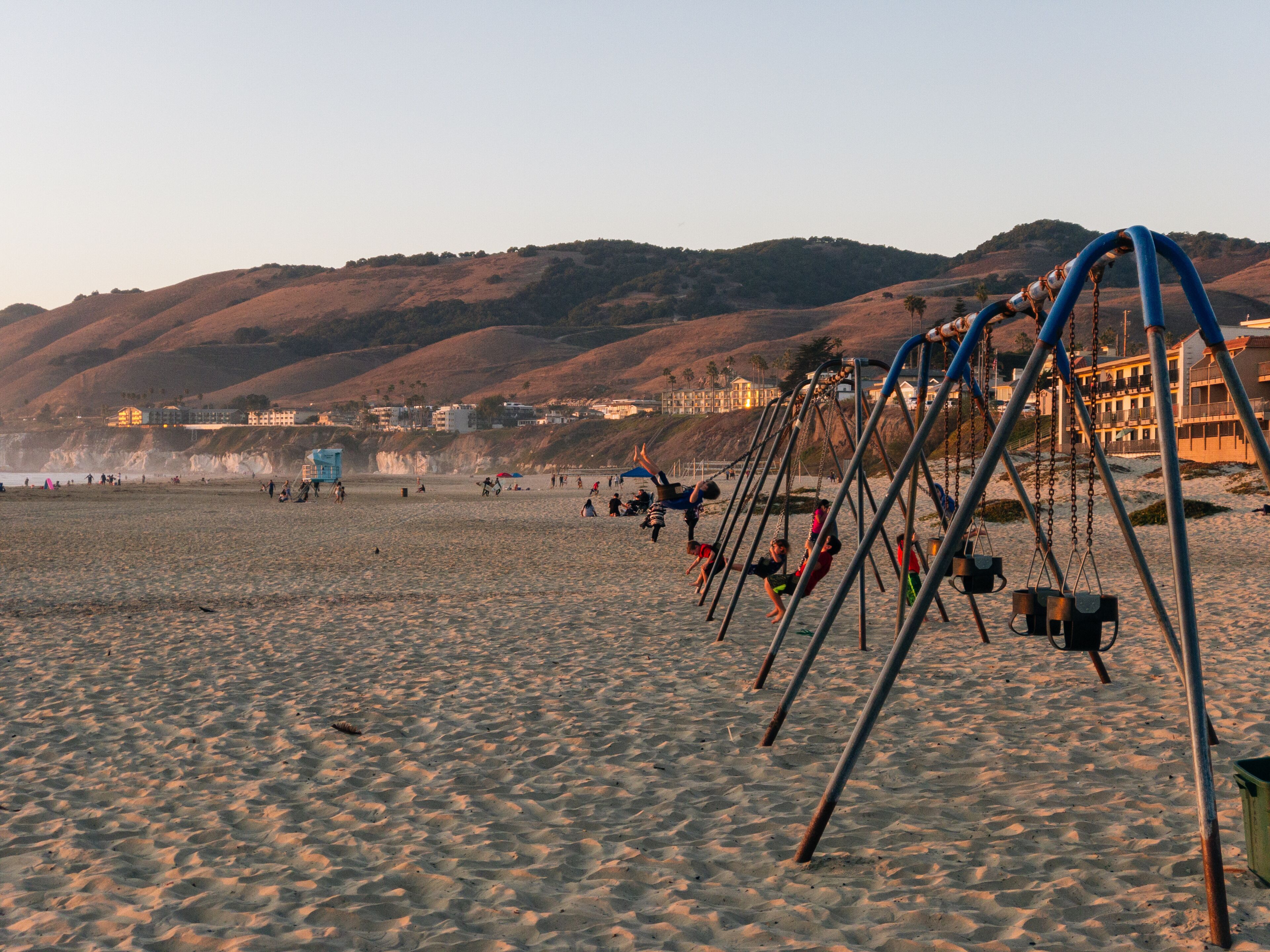 Kids Swing On The Beach