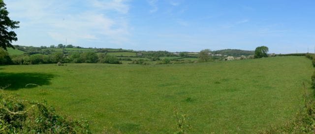Looking Towards Bryn Ddol from Bryn Poeth, Llangoed, Anglesey. A view over farmland looking towards Bryn Ddol from Bryn Poeth, Llangoed, Anglesey.