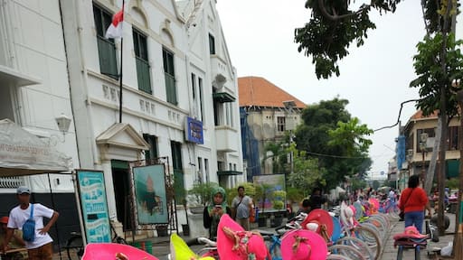 Brightly coloured bikes for hire (with matching hats) in Jakarta