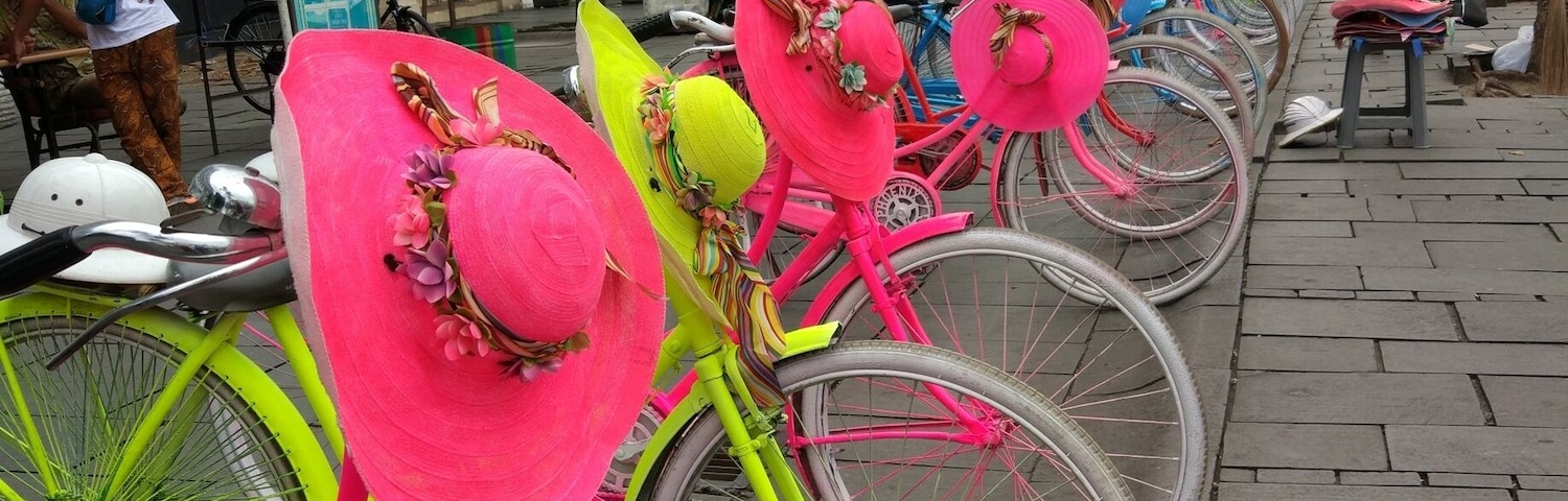 Brightly coloured bikes for hire (with matching hats) in Jakarta