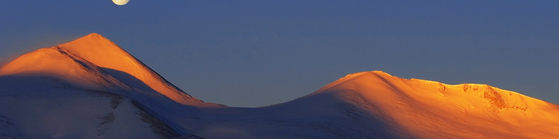 Breckenridge featuring snow, mountains and a sunset