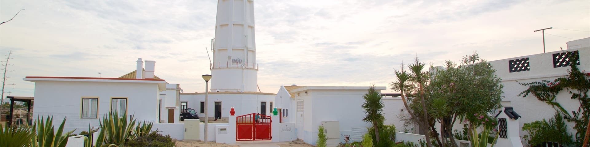 Faro which includes a sunset and a lighthouse