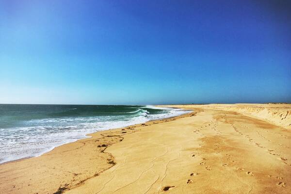 Footprints in the sand. What a beautiful beach.