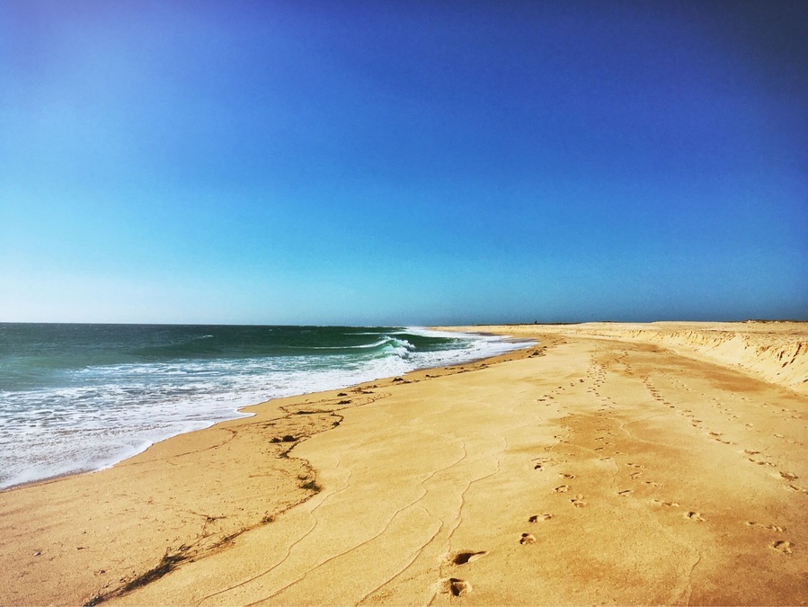 Footprints in the sand. What a beautiful beach.