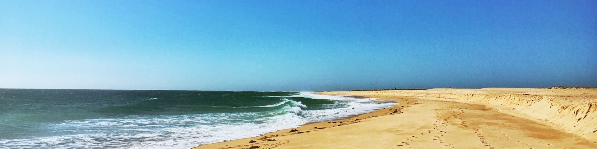 Footprints in the sand. What a beautiful beach.