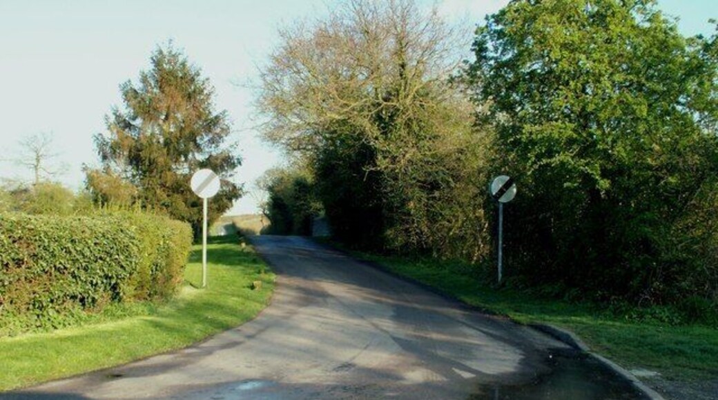 St. Stephens Road Just beyond the traffic signs is the top of a railway bridge that crosses a disused line.