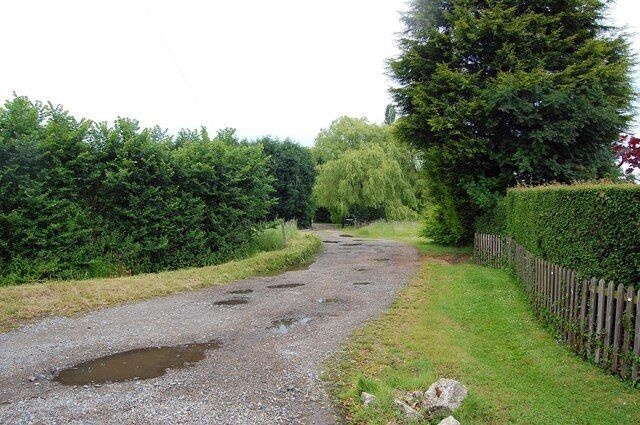 Track to Woodham Hall Unfortunately not much of the hall itself can be seen from public access areas.