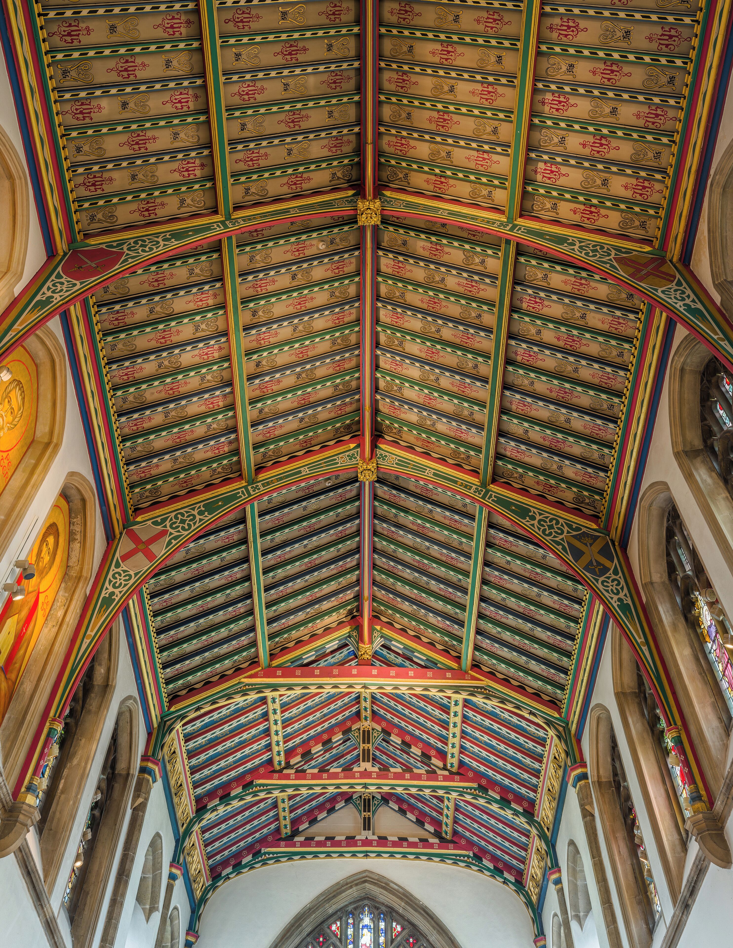A cathedral ceiling with intricate patterns and vibrant colors.