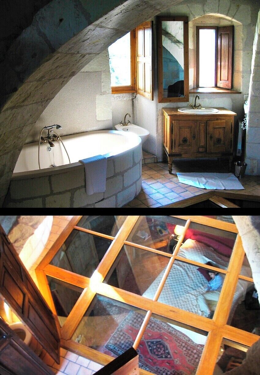 The Donjon (Tower) Room is a unique experience I'll never forget. The two-story room sits high in the Château's main turret, where a bedroom graces the lower level and glass-floor bathroom (!!) has been crammed into the upper reaches of the tower.  The toilet sits in a tiny enclosed stall, so at least your covered there. But watch your head - those arches hang low, especially in the middle of the night after you've bobbled up a narrow set of winding stairs.  Also, how is it that the bidet sits across the glass floor from the toilet??

Regardless, this is an entertaining room, and one to book if you're looking for a bit of an adventure.  But pack light - the turret stairs are difficult to navigate with bags in tow!

Historical perspective: The Château was built in the 15th century and later visited by Kings Charles VII and Louis XII.  It also played host to General Charles de Gaulle, who stayed here before fleeing to England ahead of the advancing German army.