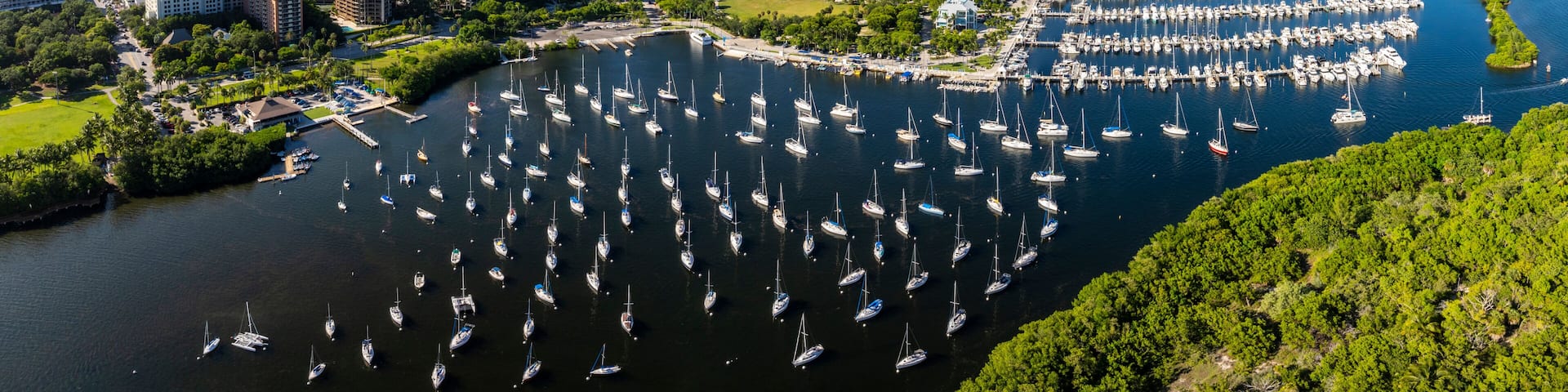 Aerial view of coconut grove marina with sailboats and cityscape, Coconut Grove, Florida, USA.
