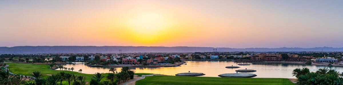 Idyllic Lakeside Golf Course with Vibrant Sunset in Scenic Landscape at El Gouna Red Sea Agypt