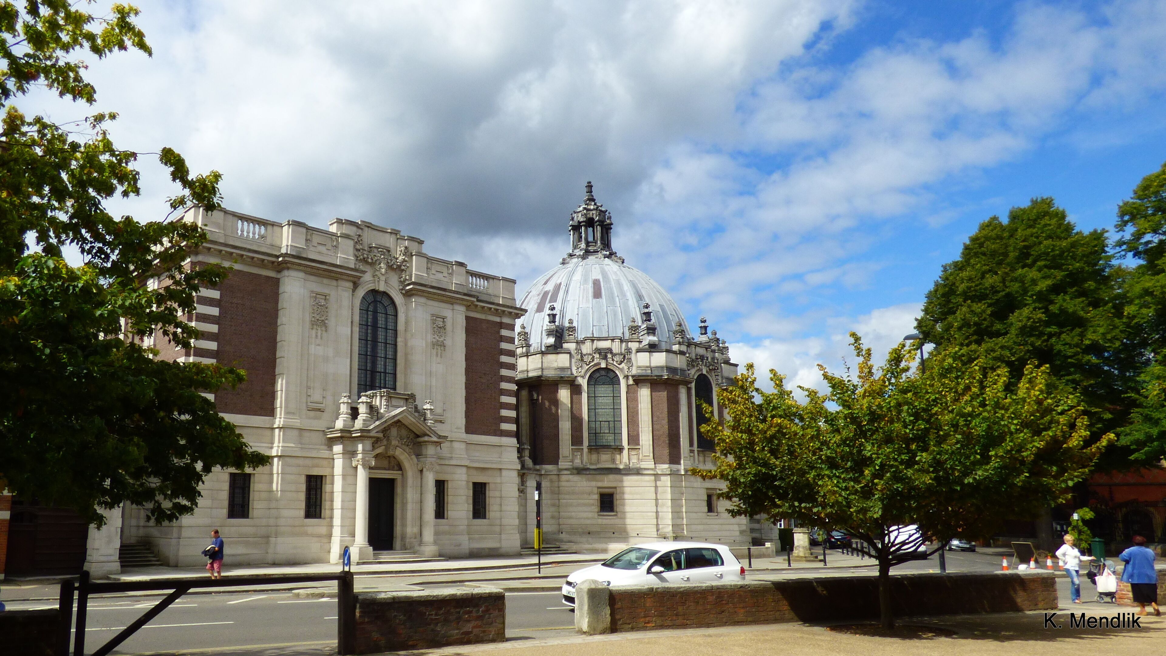 A historic building with a large dome and arched windows.