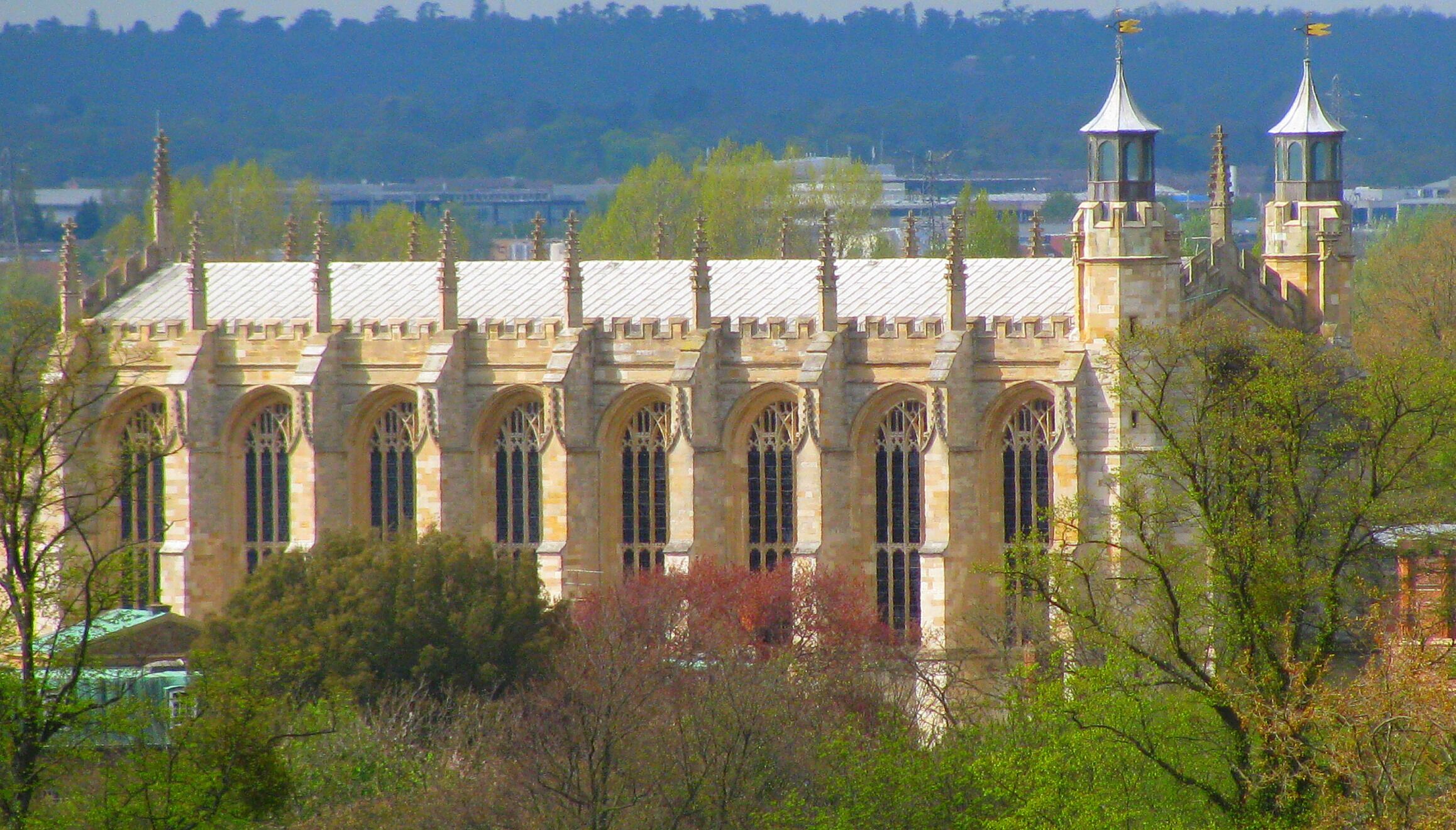 A historic building with arched windows and two towers.