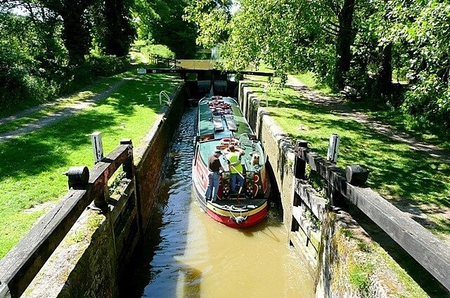 Wire lock Lock 76, with a rise of 6 feet 10 inches. The boat is being used by canal trip boat Rose of Hungerford. She was built especially as a trip boat and is 55 feet long and 10 feet 6 inches wide, thus only filling about three quarters of the 72 feet by 14 feet lock. She takes 50 passengers.