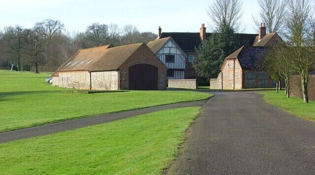 Juddmonte Farm North Approaching on the footpath to the north. An array of brick and flint barns surround the farmhouse, the original part of which dates from the late 15th century.
