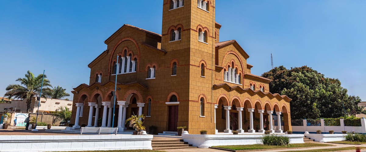 A large, historic church with a prominent bell tower and arched windows.
