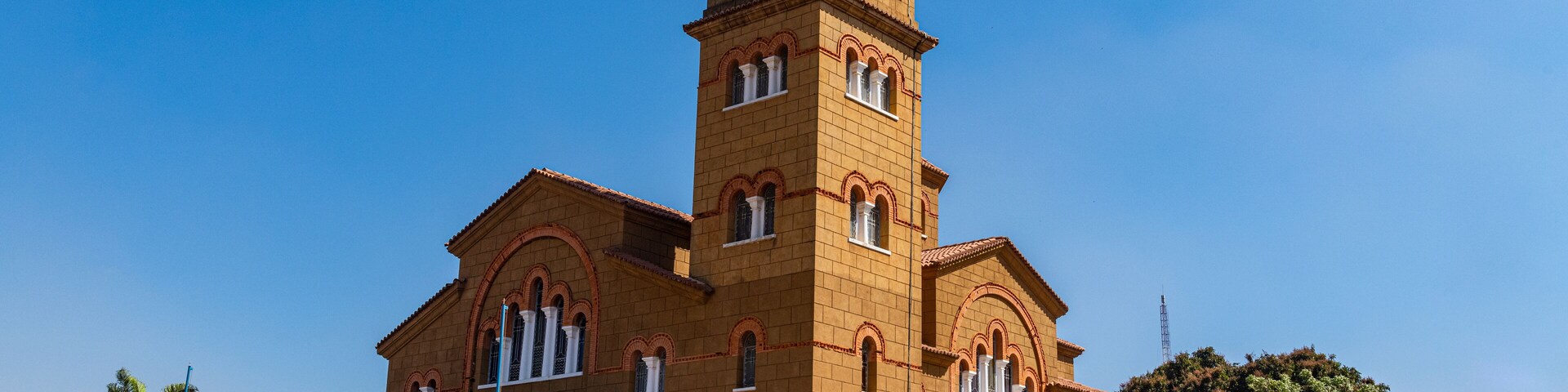 A large, historic church with a prominent bell tower and arched windows.
