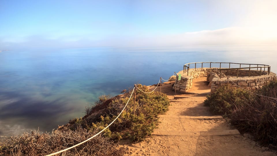 Fog drifts in over the ocean at Crystal Cove state beach