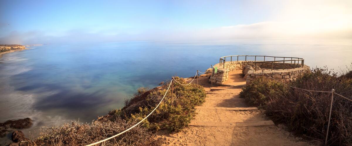 Fog drifts in over the ocean at Crystal Cove state beach