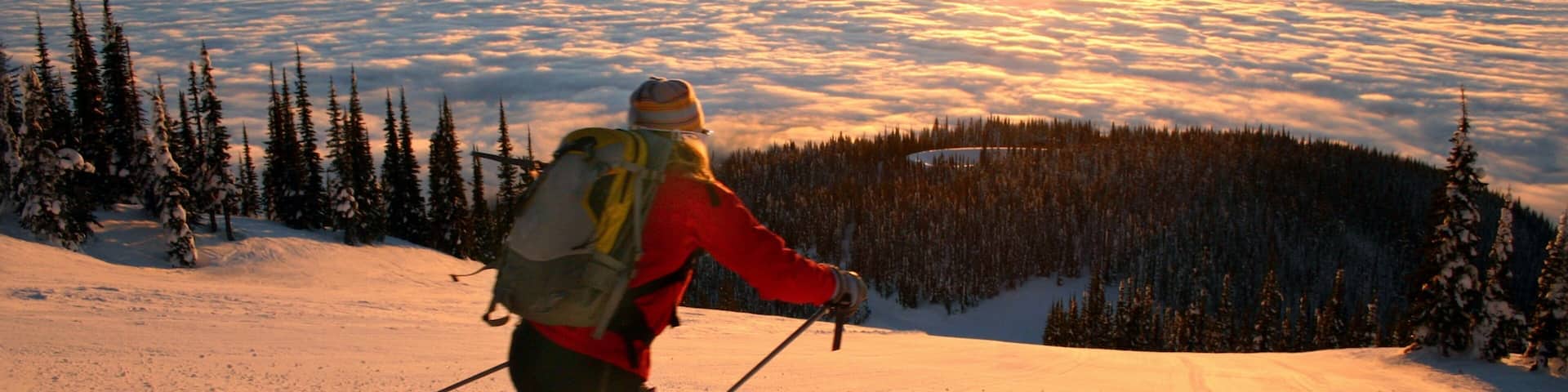 Montana which includes snow, a sunset and snow skiing