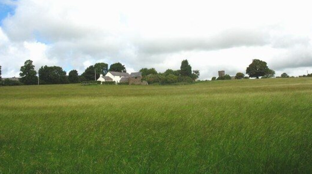 View north across a meadow towards Ty Poeth and Brynsiencyn church