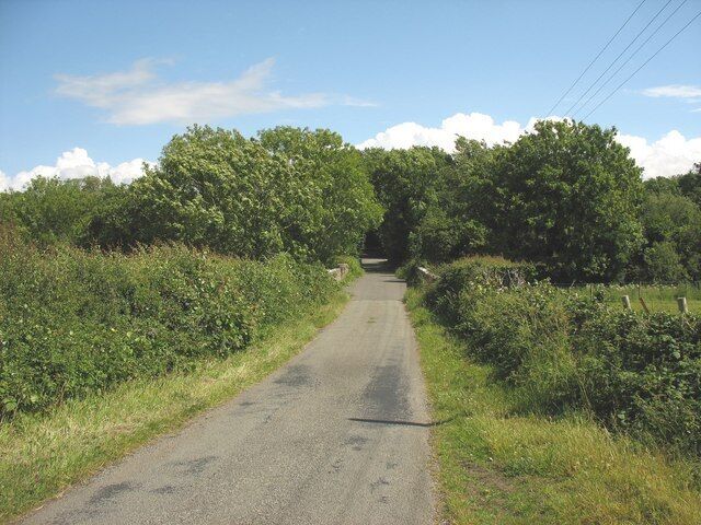 The descent to Pont Dic Pont Dic spans Afon Braint.