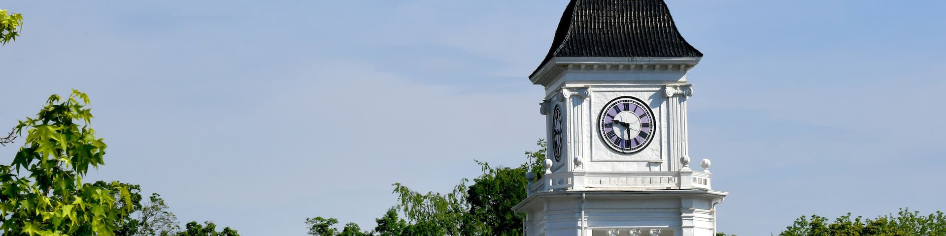Clock Tower With Purple Clock Face
