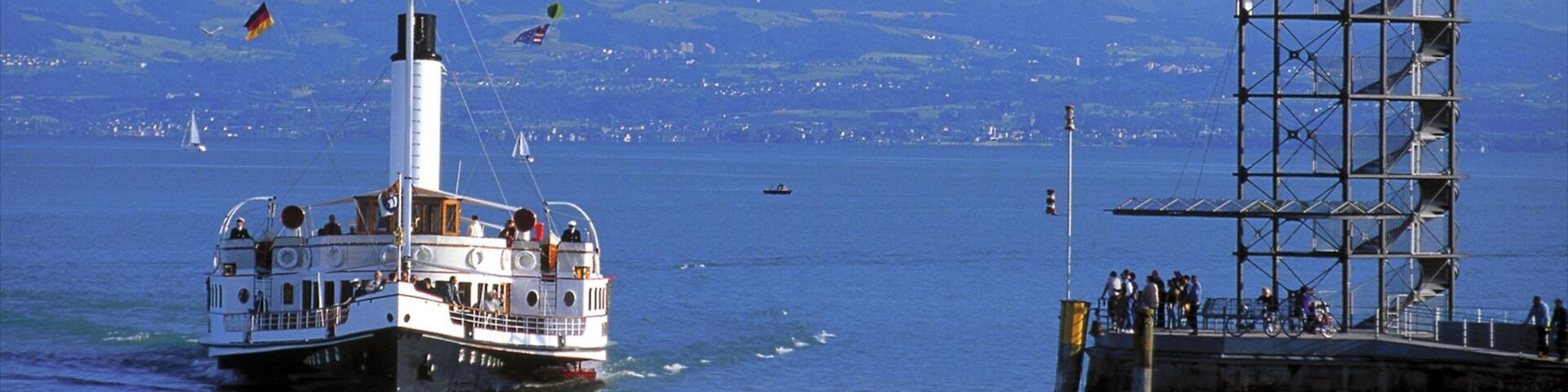 Friedrichshafen featuring skyline, a ferry and a lake or waterhole