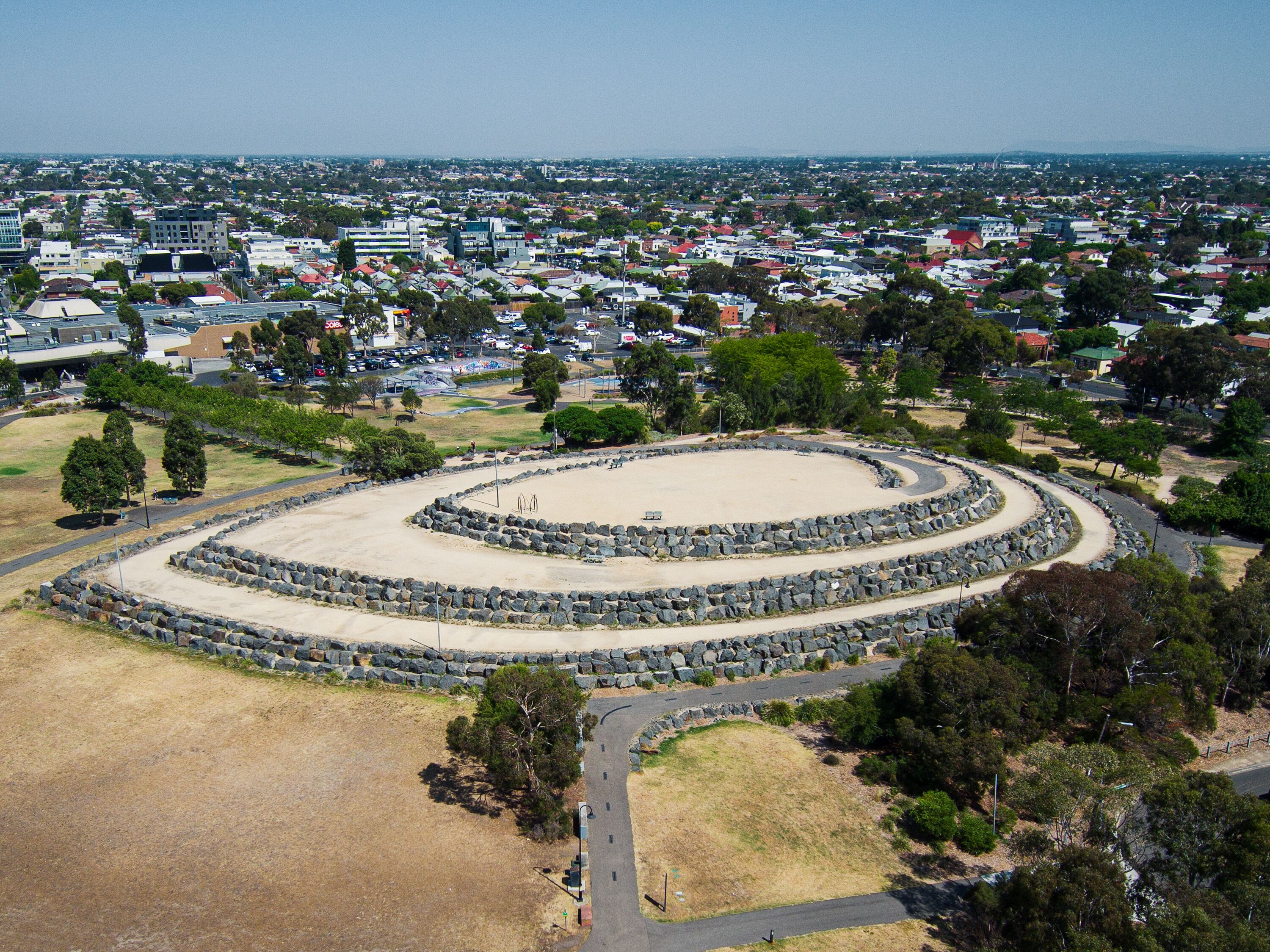 The Hilltop in the shape of a ship next to Veterans Walk and ANZAC Memorial on the site of the former Northcote Brickworks Quarry, viewed from above and the side in Melbourne, Victoria, Australia
